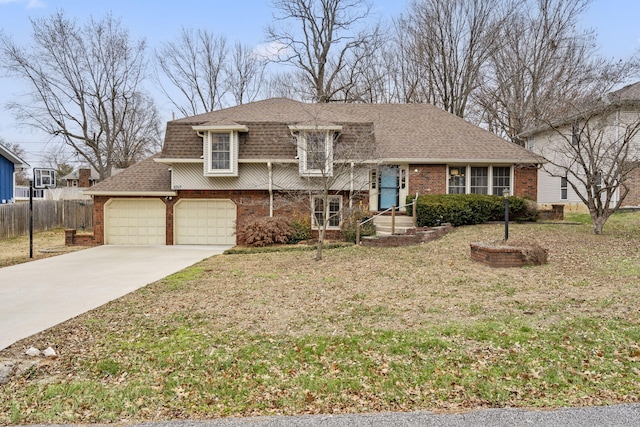 view of front of property with a front yard and a garage