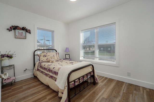 bedroom featuring wood-type flooring