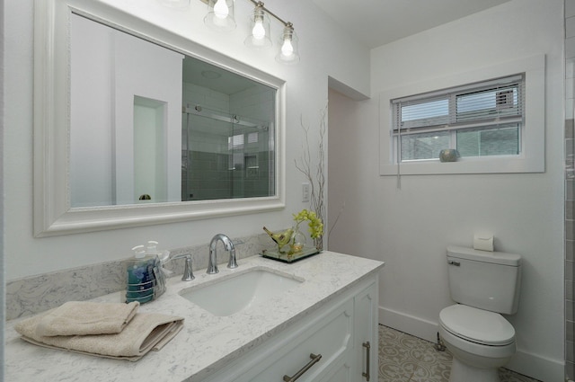 bathroom with vanity, toilet, and walk in shower