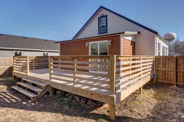 rear view of property with a wooden deck