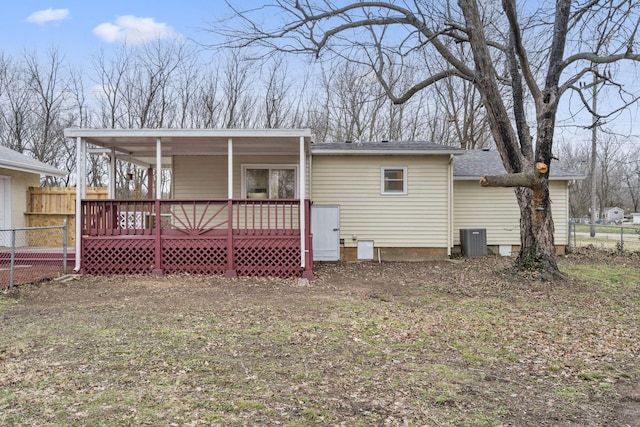 rear view of property featuring central AC unit