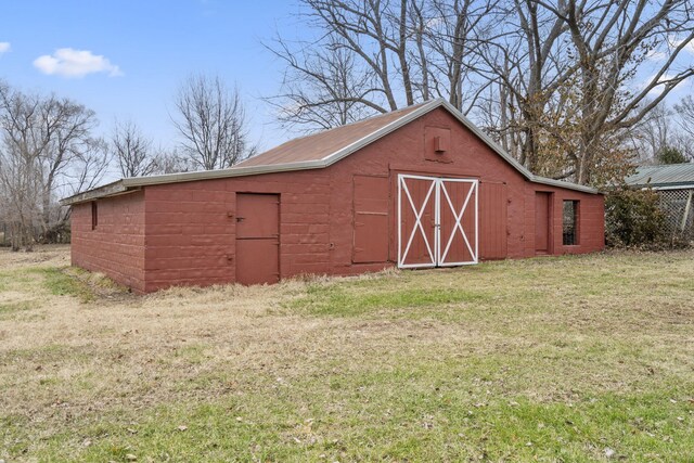 view of outdoor structure with a lawn