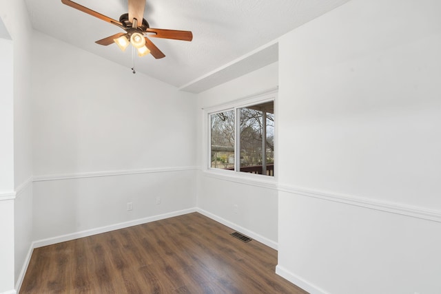 empty room featuring dark hardwood / wood-style floors and ceiling fan