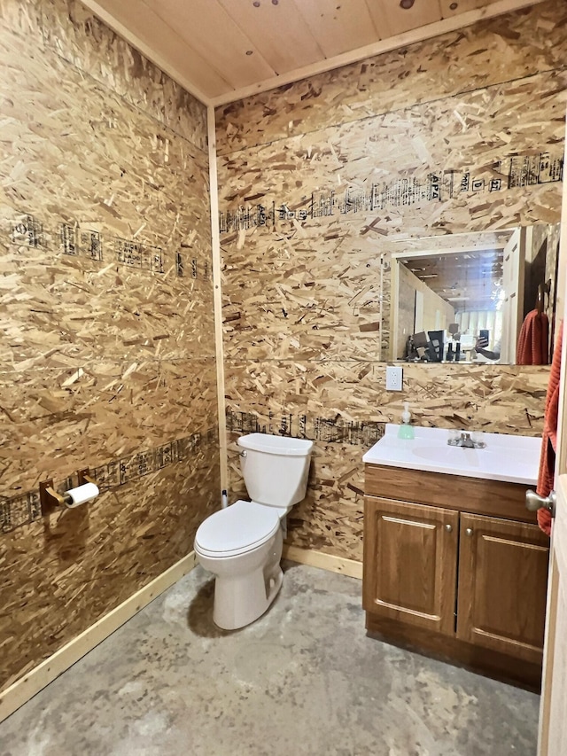 bathroom featuring vanity, toilet, and wooden ceiling