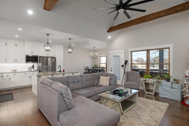 living room with beam ceiling, ceiling fan, sink, high vaulted ceiling, and dark hardwood / wood-style floors