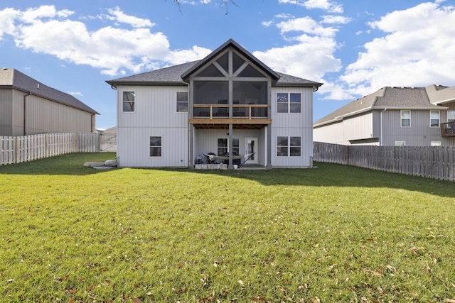 back of property featuring a patio area, a sunroom, and a yard