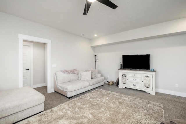 carpeted living room featuring ceiling fan