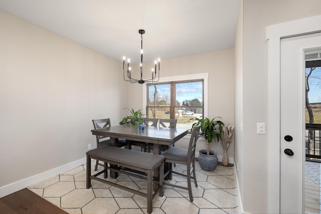 dining area featuring an inviting chandelier