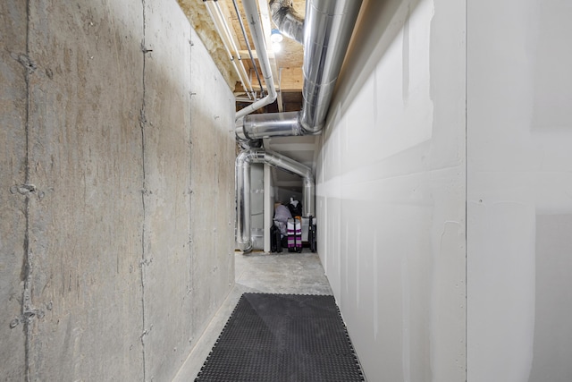 corridor with concrete flooring