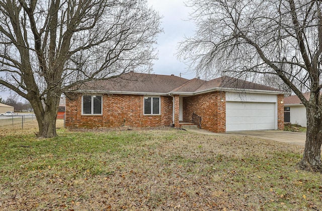 single story home with a front yard and a garage