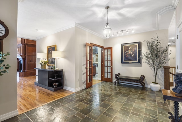 interior space featuring french doors and crown molding