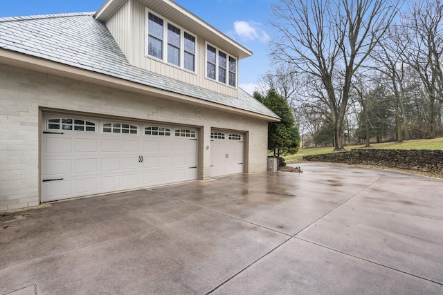 view of side of home with a garage