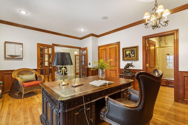 office space with a chandelier, french doors, ornamental molding, and light hardwood / wood-style flooring