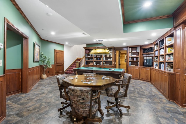 recreation room with built in features, crown molding, and pool table