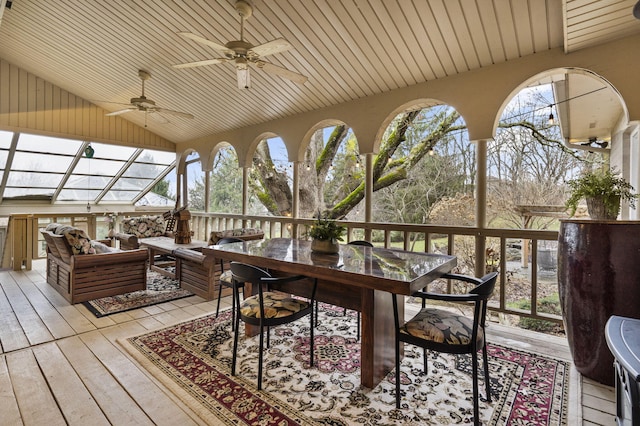 sunroom featuring ceiling fan