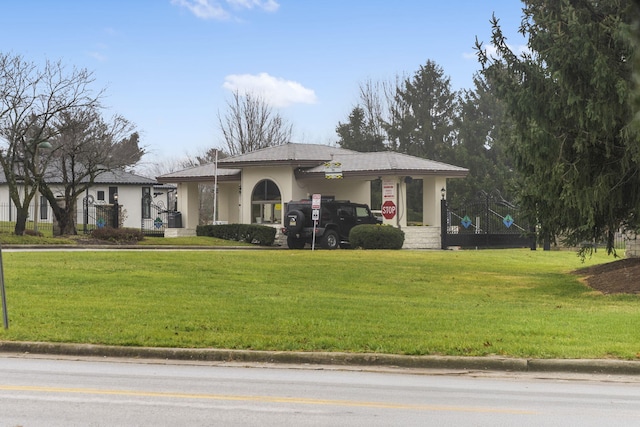 view of front of property with a front lawn