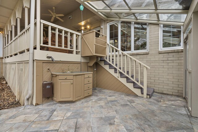 view of patio featuring ceiling fan