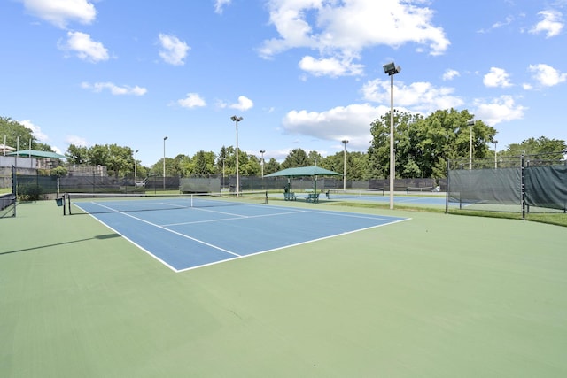 view of sport court with basketball hoop