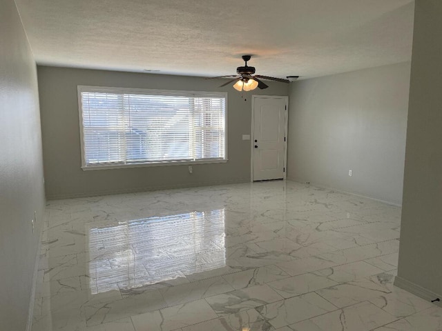 unfurnished room with ceiling fan