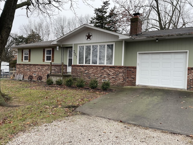 ranch-style house with a garage and a front lawn