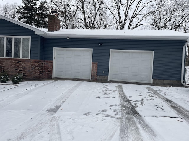 view of snow covered garage