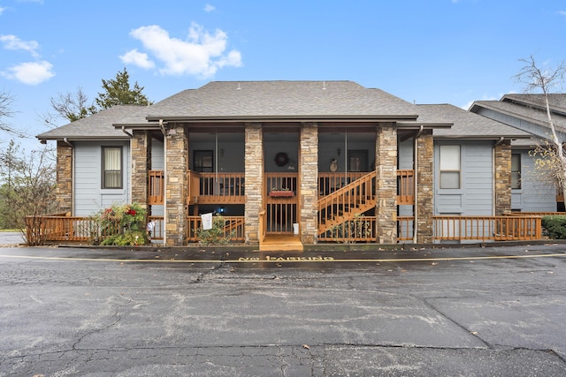 view of front of home featuring a sunroom