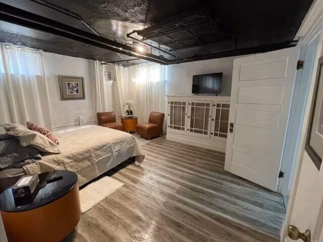 bedroom featuring hardwood / wood-style flooring