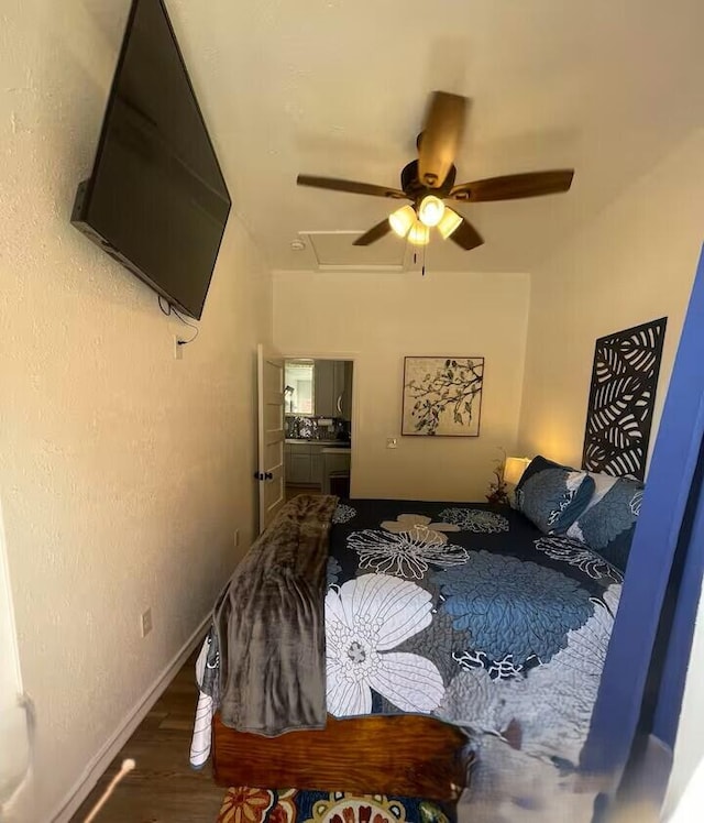 bedroom with hardwood / wood-style flooring and ceiling fan