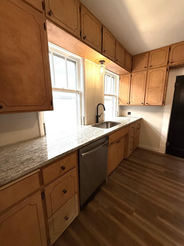 kitchen featuring stainless steel dishwasher, light stone countertops, sink, and dark wood-type flooring