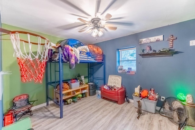 bedroom with light wood-type flooring and ceiling fan