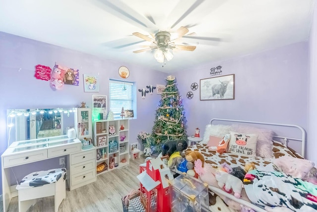 bedroom with ceiling fan and light hardwood / wood-style floors