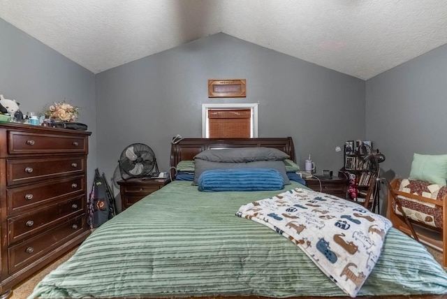 bedroom with a textured ceiling and lofted ceiling