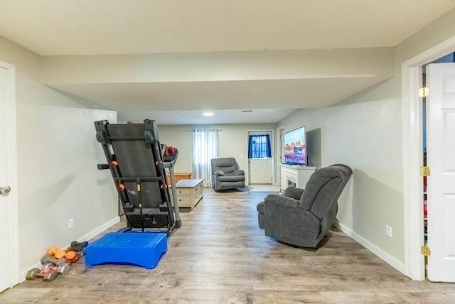 workout area with light wood-type flooring