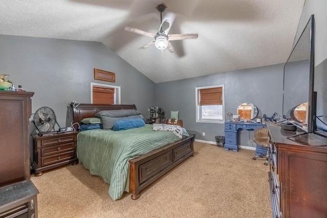 carpeted bedroom featuring a textured ceiling, vaulted ceiling, and ceiling fan