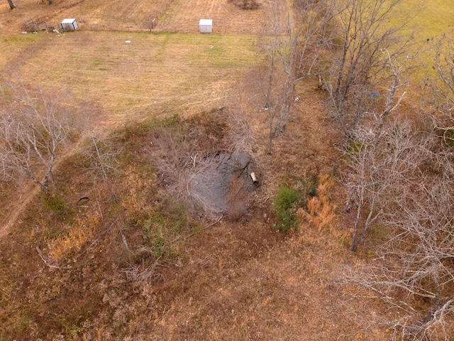 birds eye view of property featuring a rural view