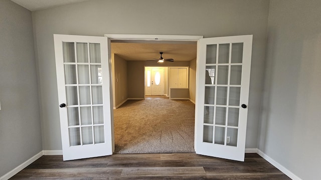 interior space with ceiling fan, dark wood-type flooring, and french doors