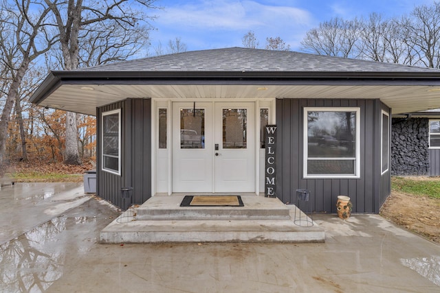 1369 E 398th Rd, Bolivar, MO 65613 - property entrance with a shingled roof and board and batten siding