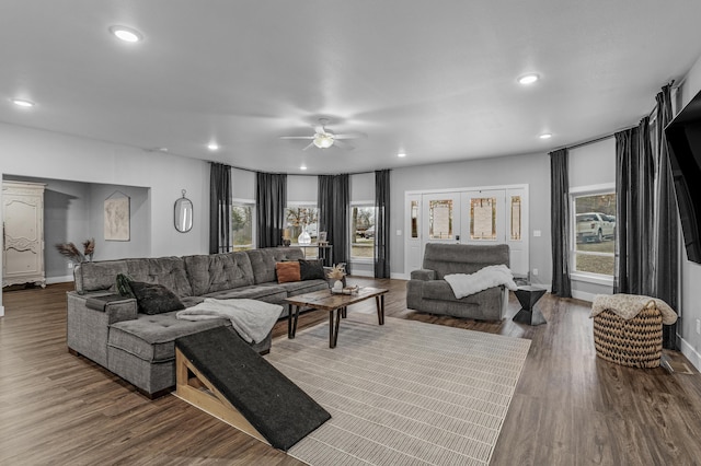 living room featuring hardwood / wood-style flooring and ceiling fan