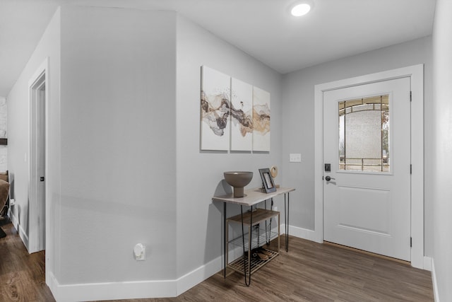 entryway with dark wood-type flooring