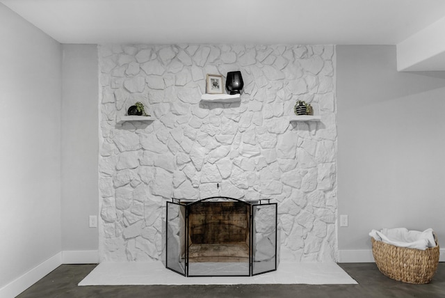 details featuring concrete flooring and a fireplace