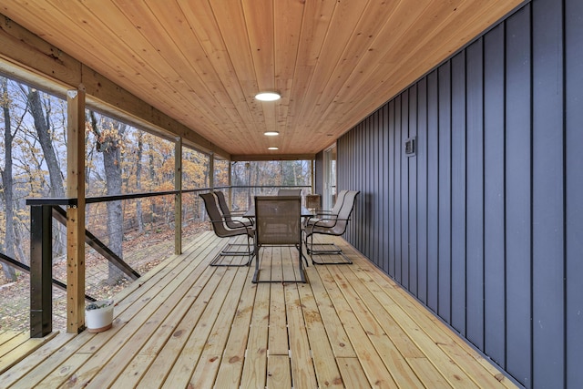 unfurnished sunroom featuring wooden ceiling