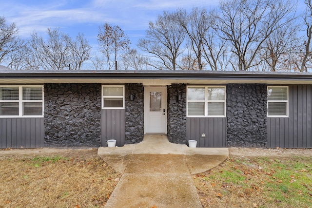 1369 E 398th Rd, Bolivar, MO 65613 - doorway to property with stone siding and a porch