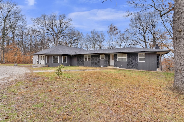 ranch-style home with a front lawn