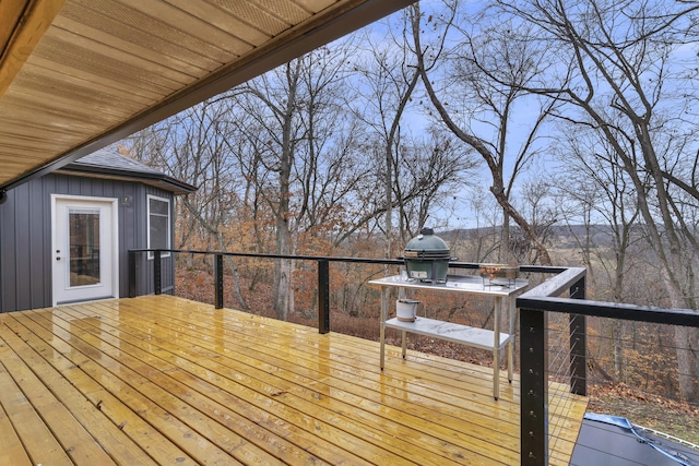 wooden terrace featuring a grill