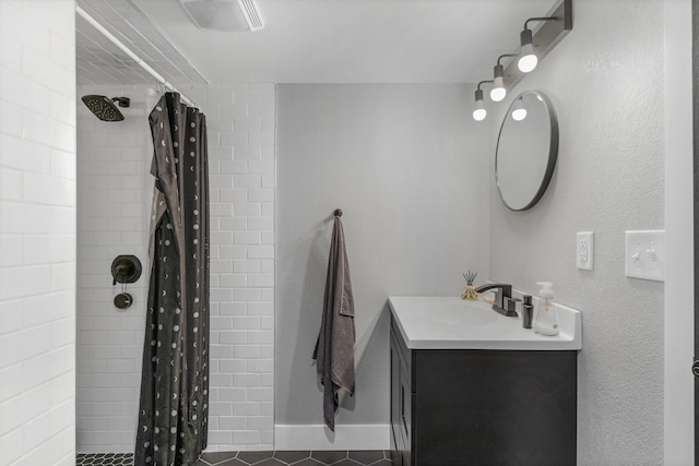 bathroom featuring a shower with shower curtain, vanity, and tile patterned flooring