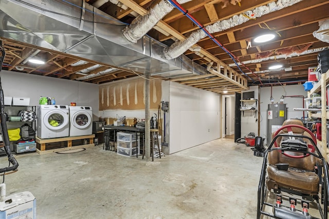 basement with washer and dryer and water heater