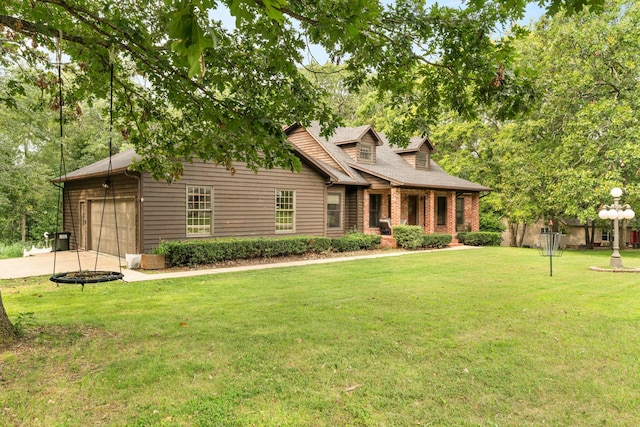 view of front of house featuring a garage and a front lawn