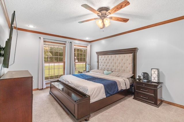 carpeted bedroom with a textured ceiling, ceiling fan, and ornamental molding