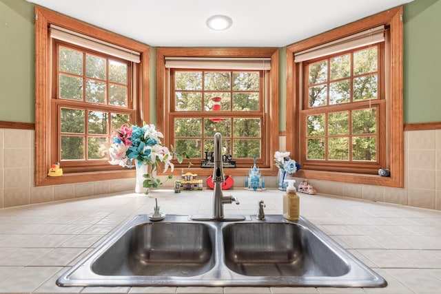 kitchen featuring tile countertops and sink