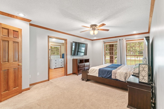 carpeted bedroom with multiple windows, a textured ceiling, ceiling fan, and ornamental molding